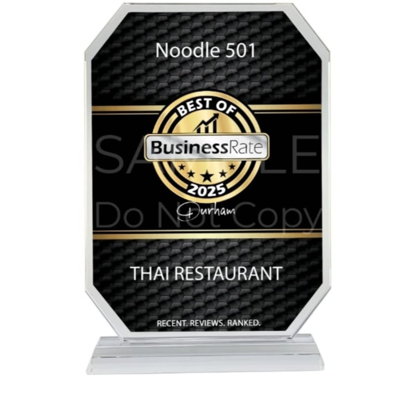 Noodle 501's "Best of BusinessRate 2025" award for Thai Restaurant, a black and gold plaque.
